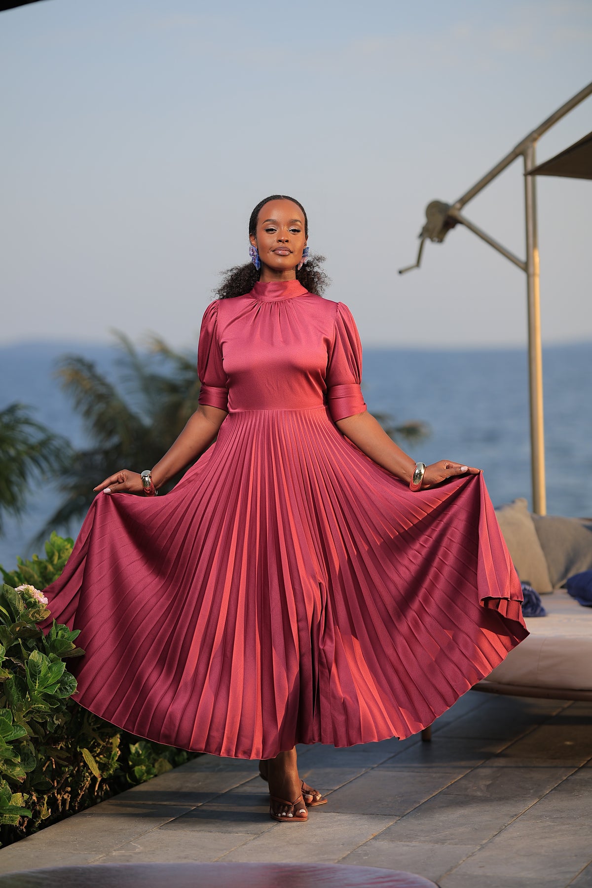 The Suubi Burgundy Pleated Maxi Dress