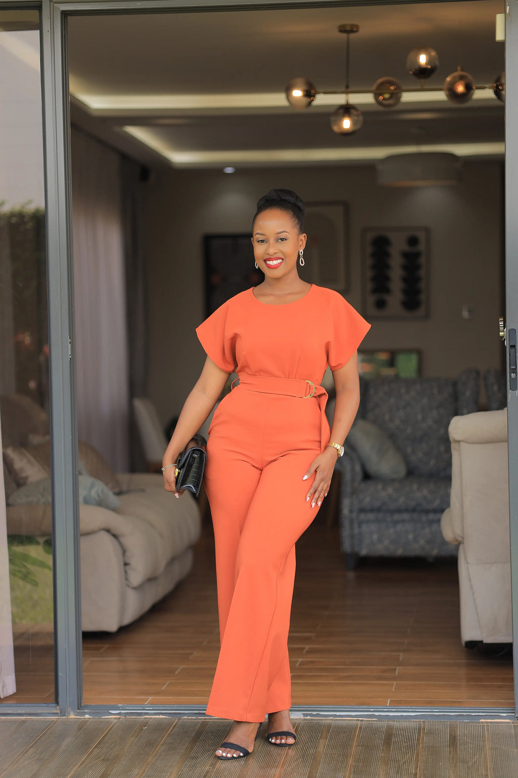 The isimbi belted Orange jumpsuit